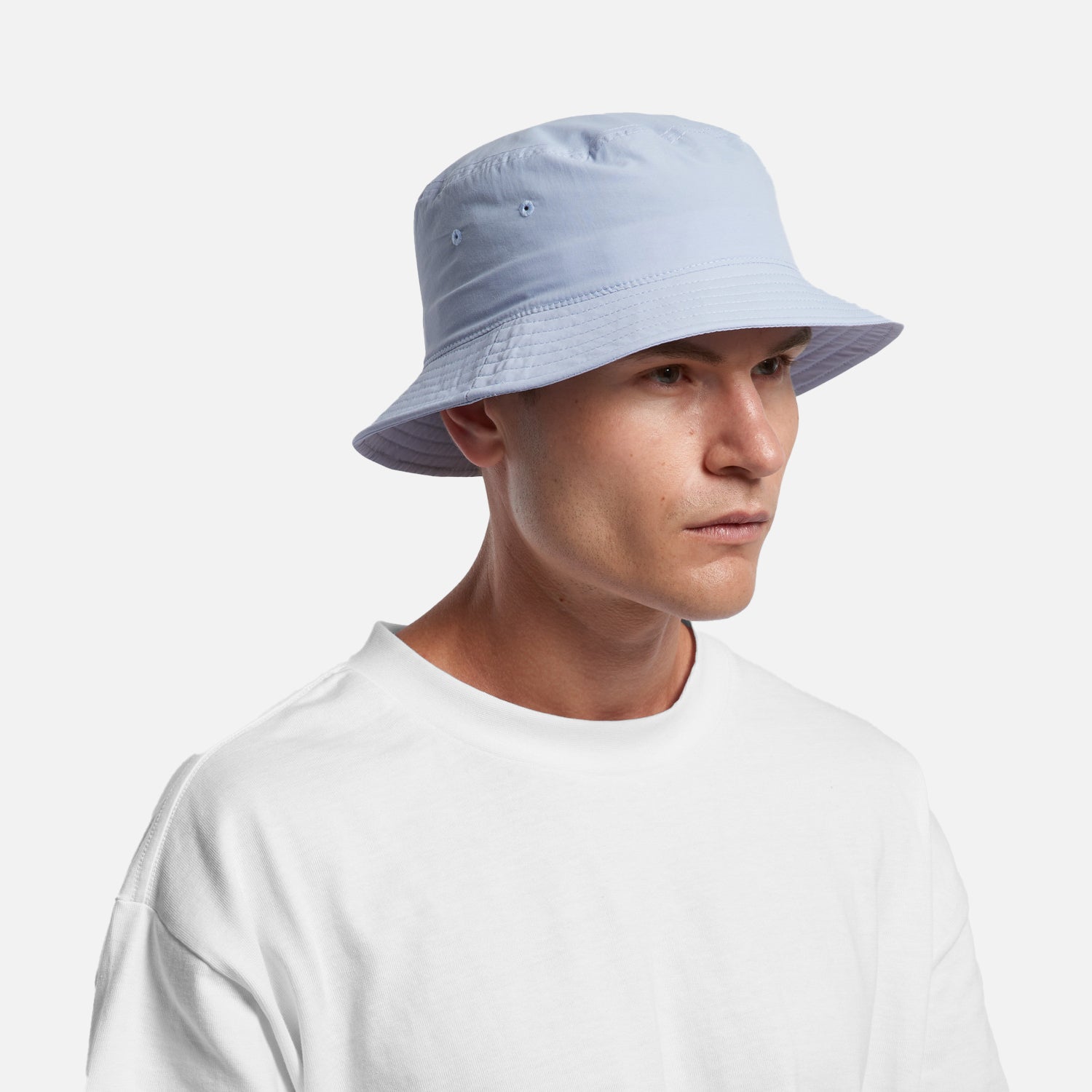 Male model wearing Look Design custom branded bucket hat in white