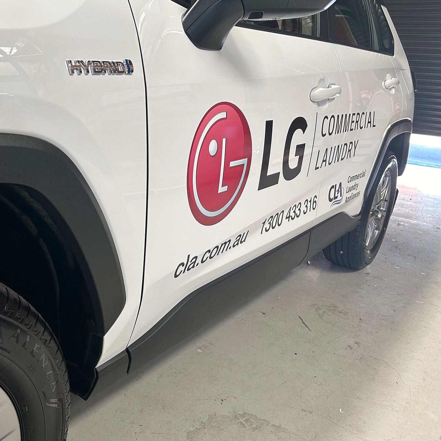 Look Design custom branded vehicle signage on a white vehicle