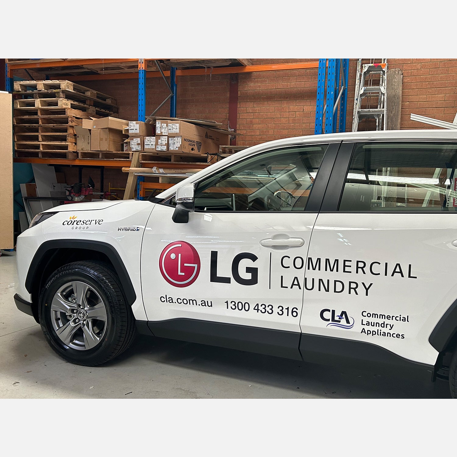 Look Design custom branded vehicle signage on a white vehicle