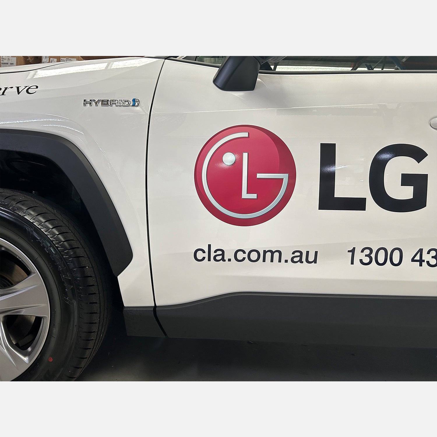 Look Design custom branded vehicle signage on a white vehicle door 